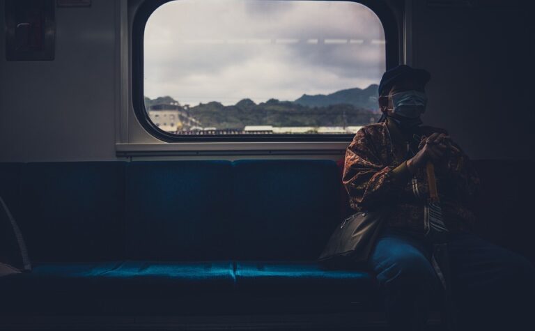 How can backpackers meet people and avoid feeling lonely